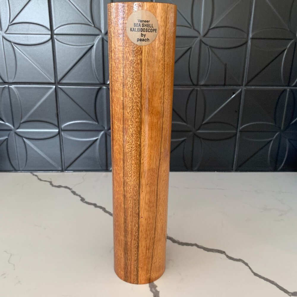 Signed Peach Reynolds Seashell Kaleidoscope.